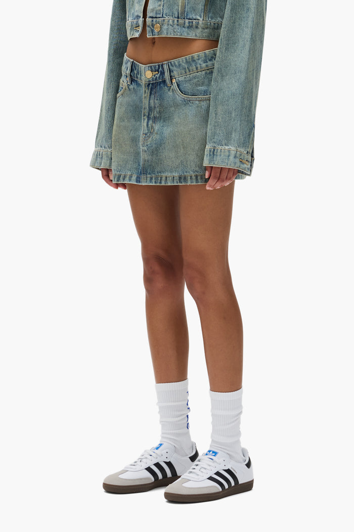 Tiled Overlay Mini Skirt with front zipper fly and 5 pocket style, available in multiple sizes.