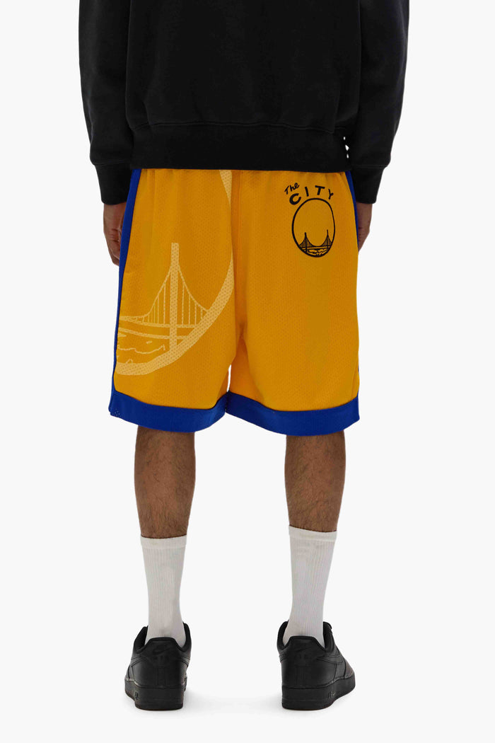 Warriors Mesh Shorts with elastic waistband and raw edge finish, part of Mitchell & Ness collaboration.
