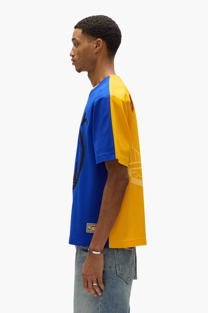 Warriors Mesh Tee oversized fit in mesh fabric with embroidered graphics and contrast colors.