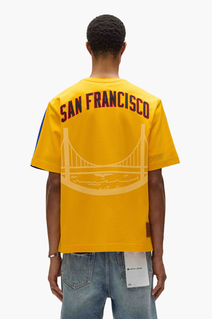 Warriors Mesh Tee oversized fit in heavyweight mesh with embroidered graphics and contrast colors.
