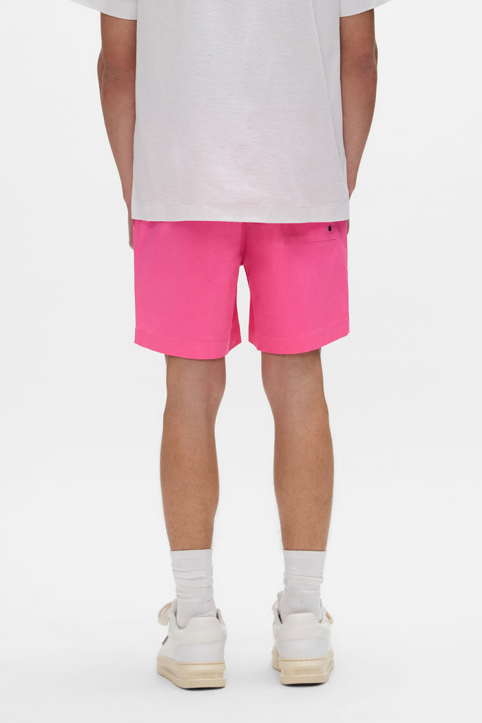 Wordmark Cut All Around Short in pink, 100% polyester swimwear with elastic waistband.