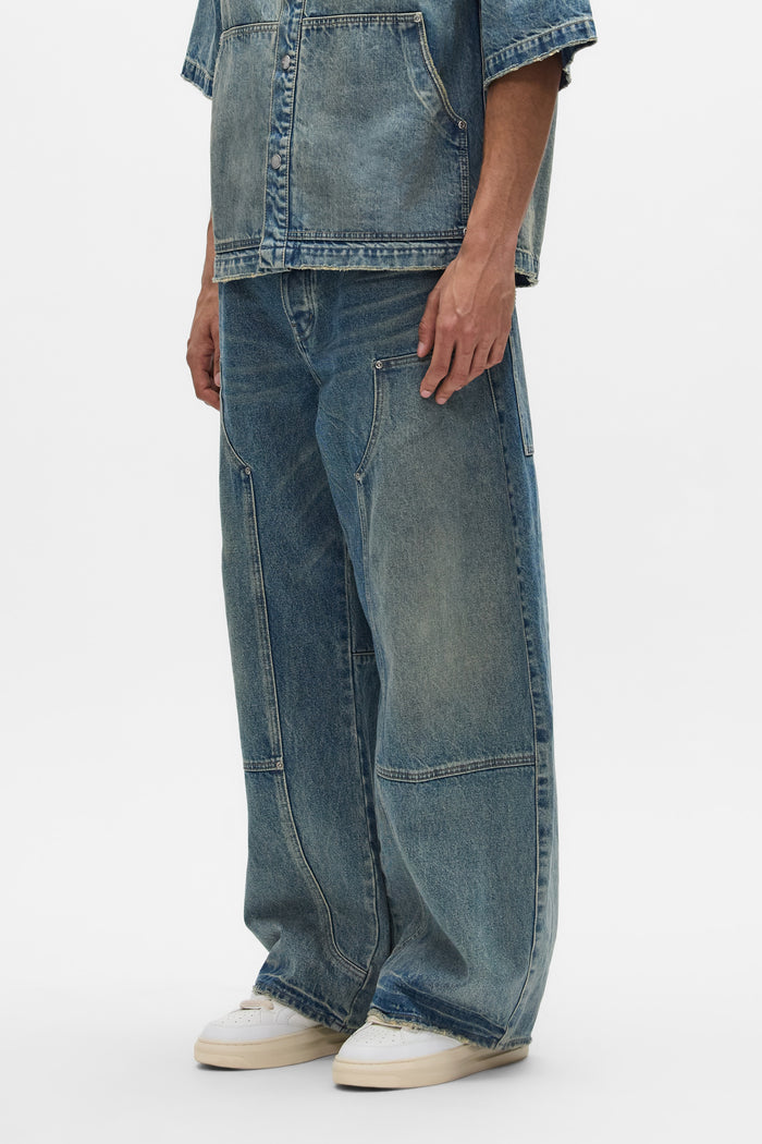 Workwear Barrel Jean denim in Washed Indigo with barrel leg and mid rise design.