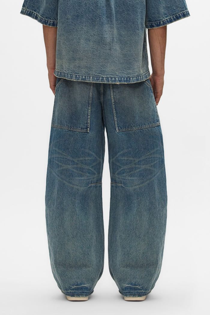 Workwear Barrel Jean in Washed Indigo with barrel leg and mid rise design.
