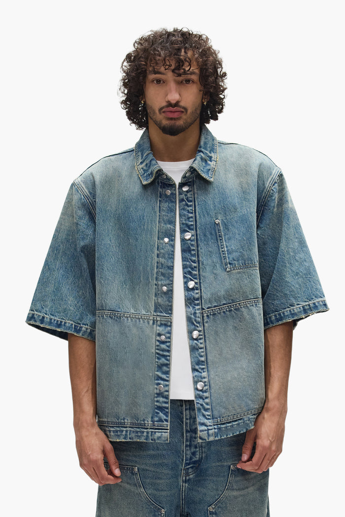 Washed Indigo Workwear Shirt, oversized and cropped length with snap front closure.