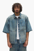 Washed Indigo Workwear Shirt, oversized and cropped length with snap front closure.