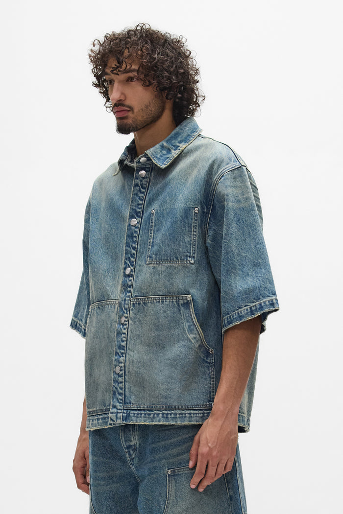 Workwear Shirt in Washed Indigo, oversized style with cropped length and snap front closure.
